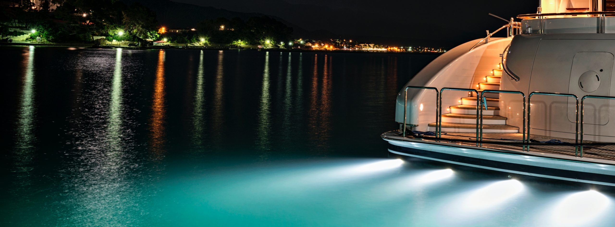 boat lights at night in the water